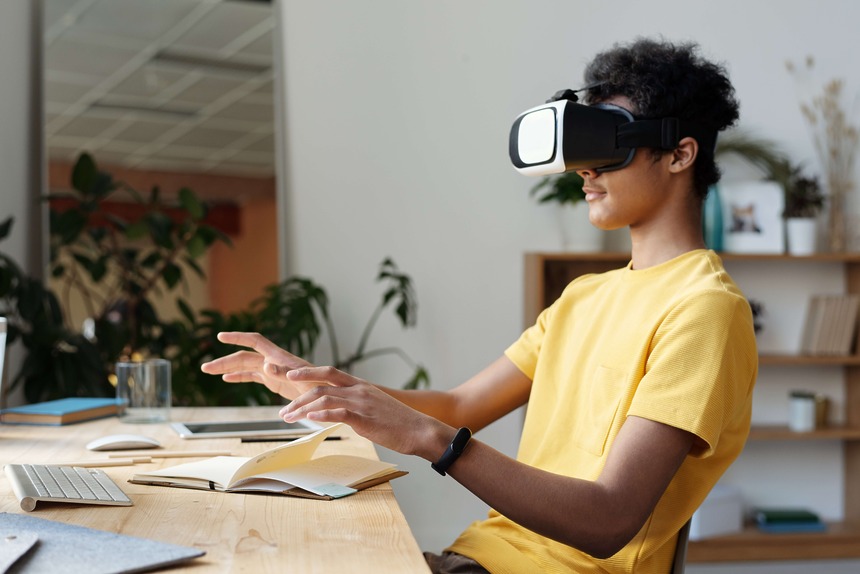 a teenager wearing a VR machine for Metaverse